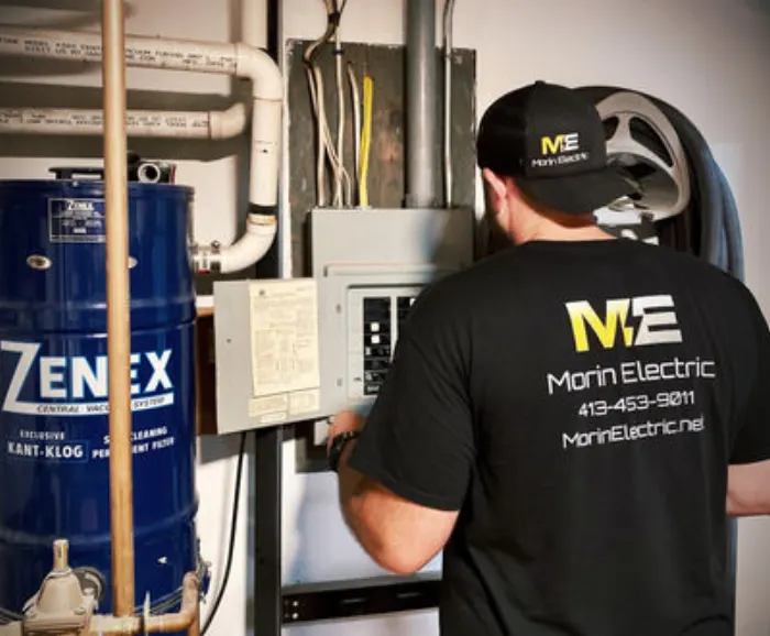 Brent Morin working at an electrical panel